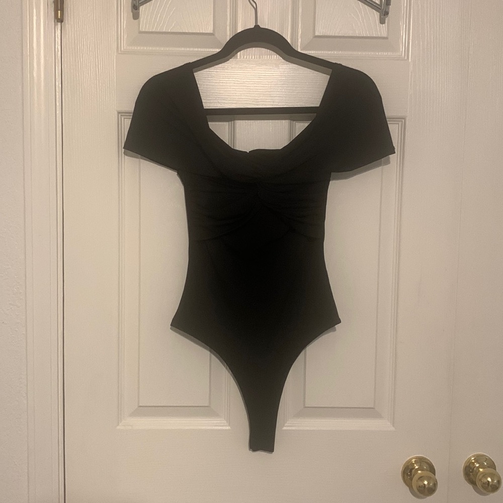 Beautiful NWT black bodysuit!